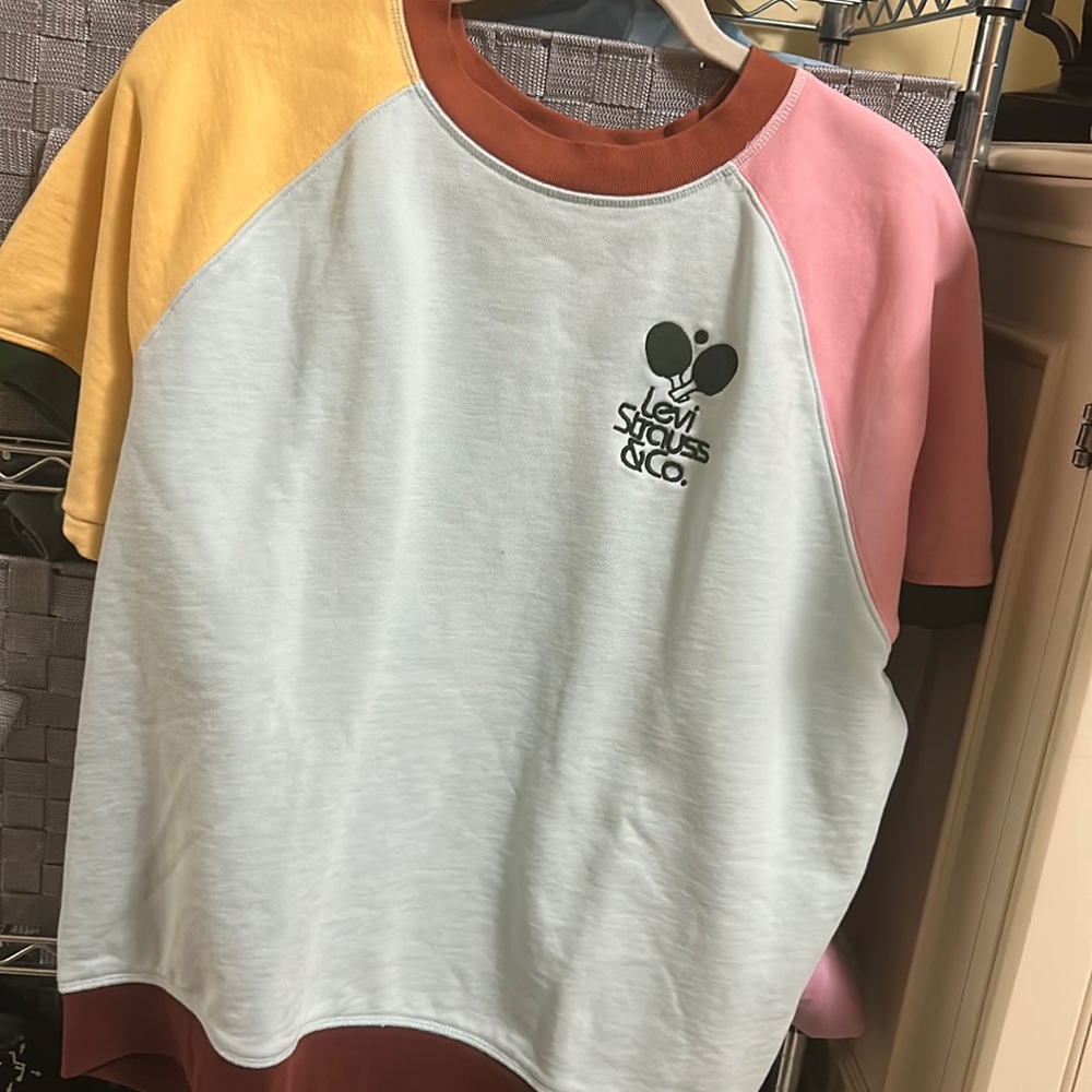 Multi colored Levi short sleeve shirt. Super cute only won one time..